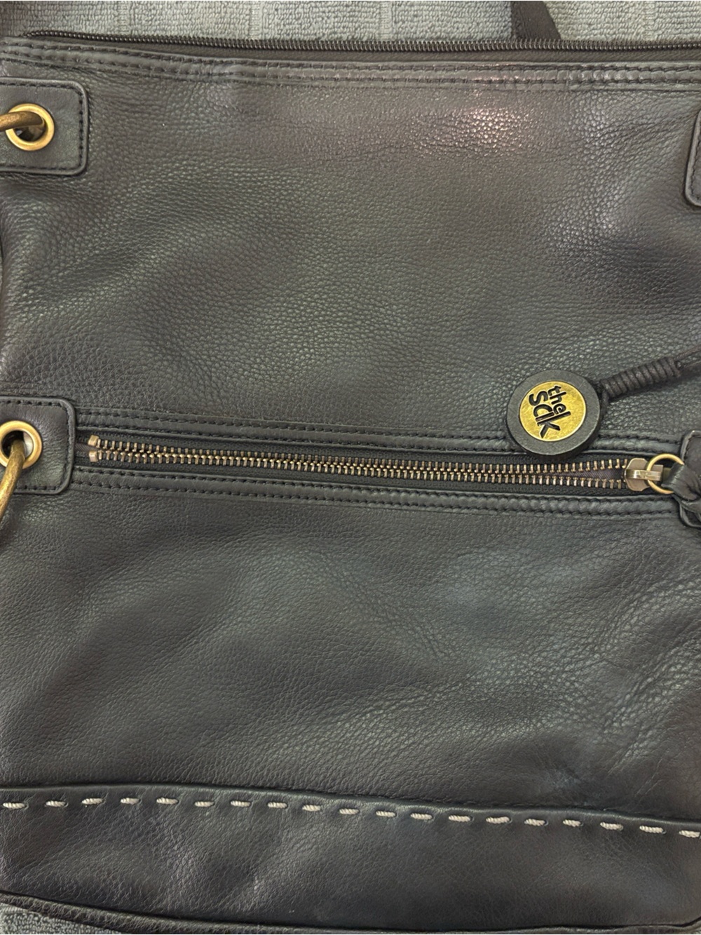 The Sak Black Leather Messenger Bag with Gold Hardware
